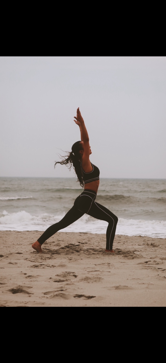 Julia practicing yoga on the beach